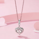 Baby Feet in Heart Hands Dangle Charm