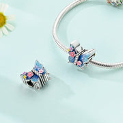 Blue Butterfly Charm with Glittering Floral Accents