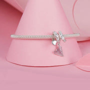 Crystal-Studded Heart Spiral with Pink Paper Plane Charm