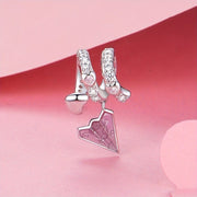 Crystal-Studded Heart Spiral with Pink Paper Plane Charm