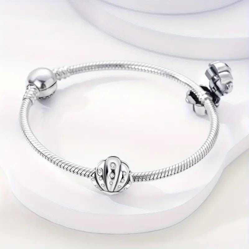 Silver Seashell charm detail view