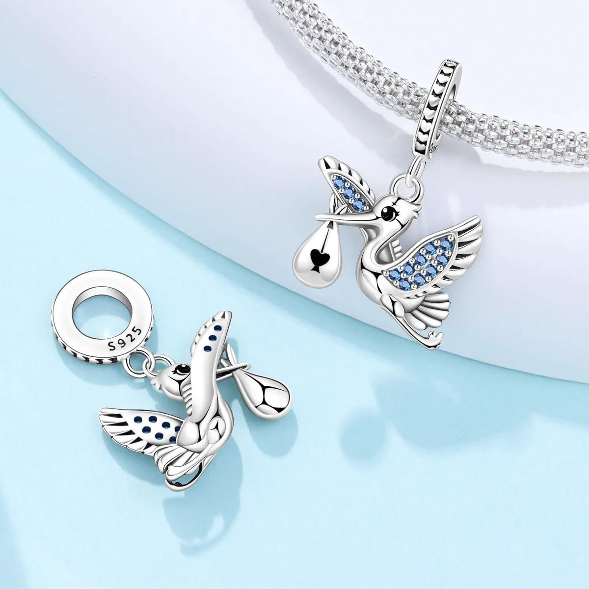 Stork charm detail view