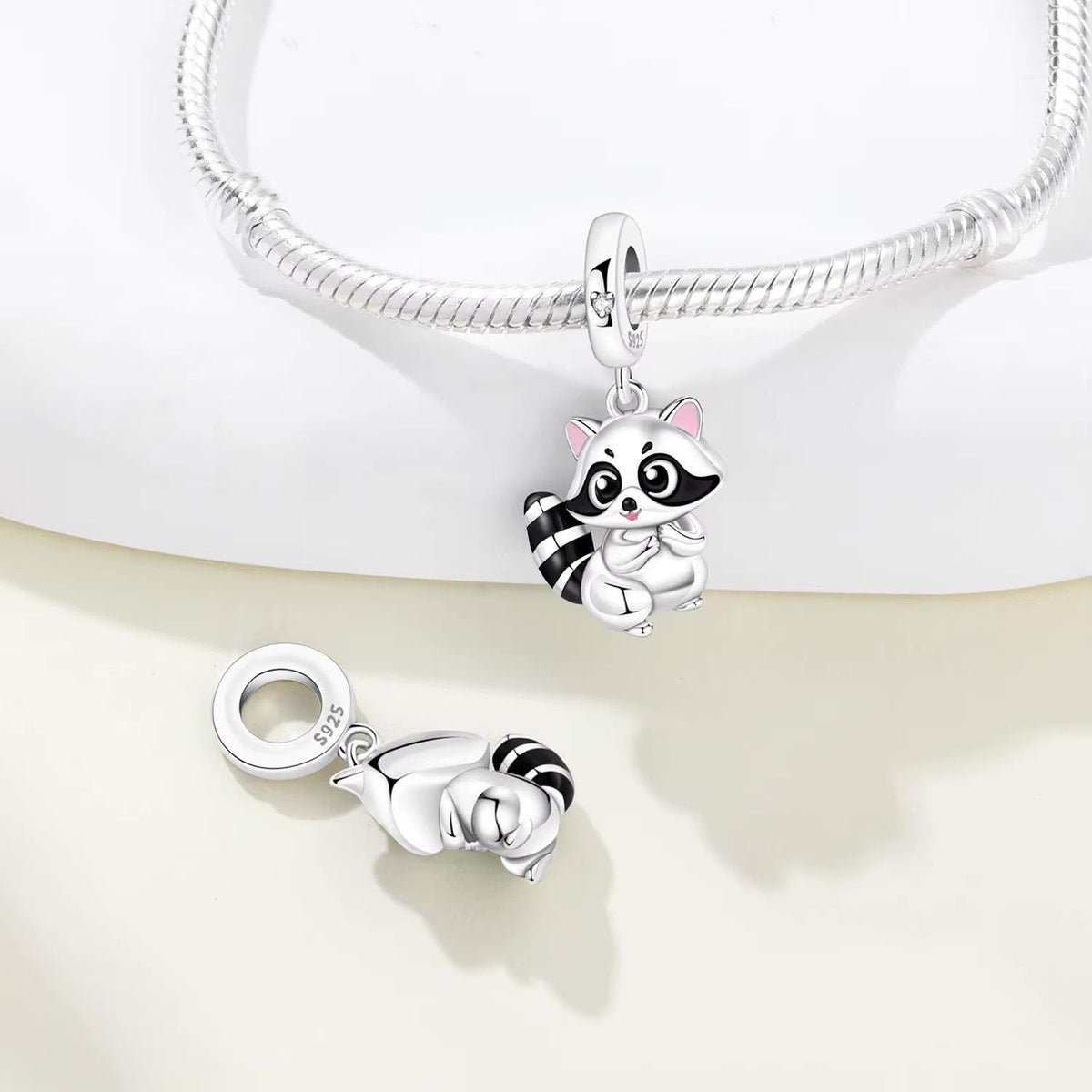 Raccoon charm detail view