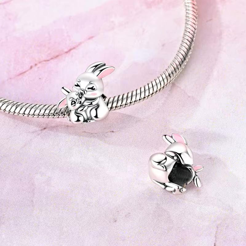 Hugging Bunnies charm detail view