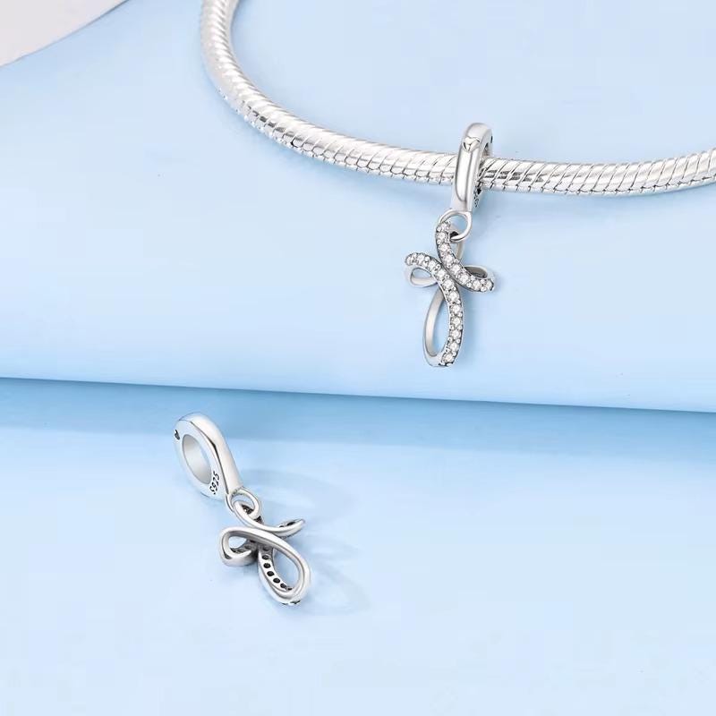Silver Infinite Cross charm detail view