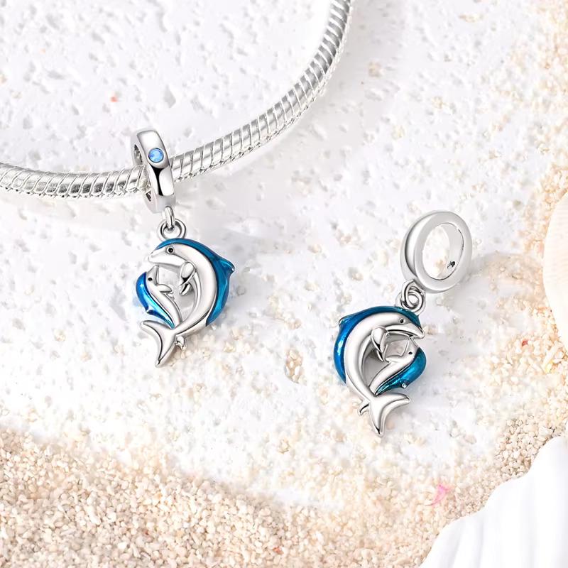 Mother Baby Dolphin charm detail view