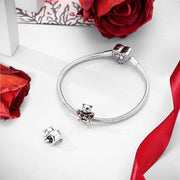 Smiling Bear Holding Red Hearts Charm