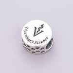 Veterinary Science Symbol with Green Crystal Charm