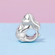 Winking Bunny with Heart-Shaped Egg Charm
