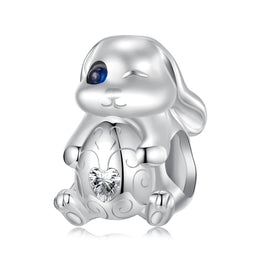 Winking Bunny with Heart-Shaped Egg Charm